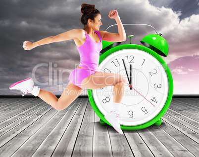 Composite image of fit brunette running and jumping