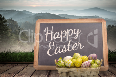 Composite image of easter eggs in basket