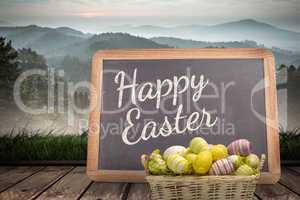 Composite image of easter eggs in basket