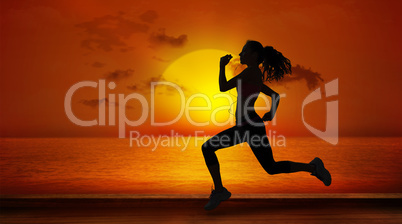 Composite image of full length of healthy woman jogging