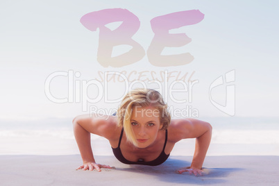 Composite image of fit blonde in plank position on the beach