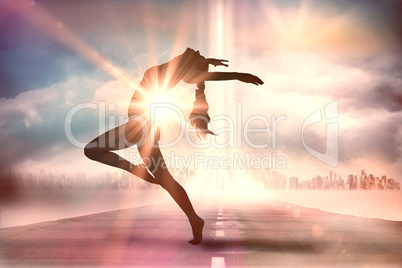 Composite image of side view of a sporty young woman stretching