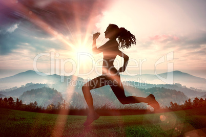 Composite image of full length of healthy woman jogging