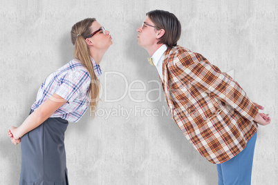 Composite image of geeky hipster couple kissing