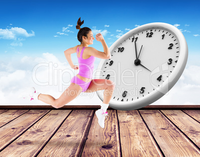 Composite image of fit brunette running and jumping