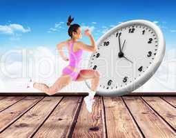 Composite image of fit brunette running and jumping