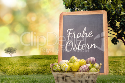 Composite image of easter eggs in basket