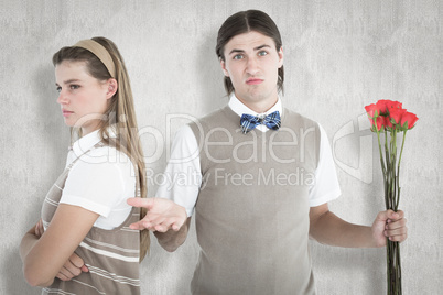 Composite image of geeky hipster couple not talking after argume