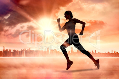 Composite image of pretty fit blonde jogging