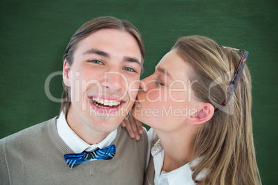 Composite image of pretty geeky hipster giving boyfriend kiss on