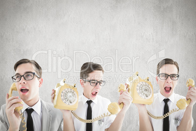 Composite image of nerdy businessman with phone