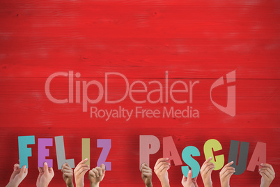 Composite image of hands holding up feliz pasqua