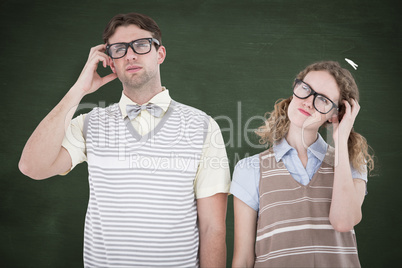 Composite image of geeky hipster couple thinking with hand on te