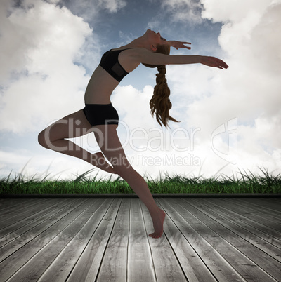 Composite image of side view of a sporty young woman stretching