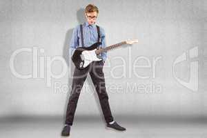 Composite image of geeky hipster playing the guitar