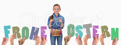 Composite image of hands holding up frohe ostern
