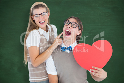 Composite image of excited geeky hipster and his girlfriend