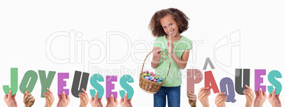 Composite image of hands holding up joyeuses pasques