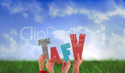 Composite image of hands holding up tafv