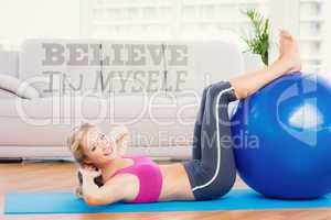 Composite image of cheerful fit blonde doing sit ups with exerci