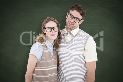 Composite image of happy geeky hipster couple with silly faces