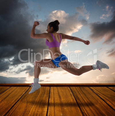 Composite image of fit brunette running and jumping