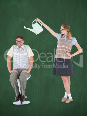 Composite image of geeky hipster holding watering can above her