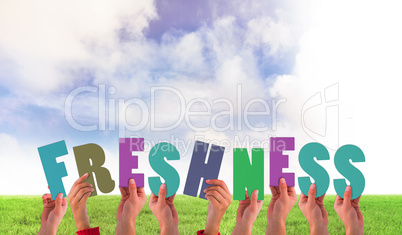 Composite image of hands holding up freshness