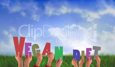 Composite image of hands holding up vegan diet