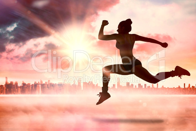 Composite image of fit brunette running and jumping