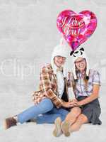 Composite image of geeky hipster in love couple looking at camer