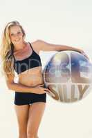 Composite image of fit blonde holding exercise ball at the beach