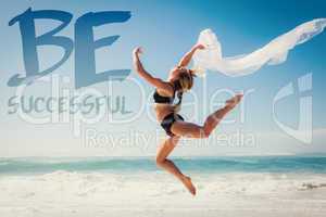 Composite image of fit blonde jumping gracefully with scarf on t