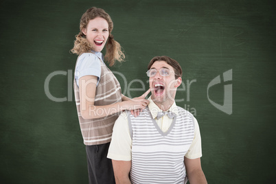 Composite image of excited geeky hipster couple