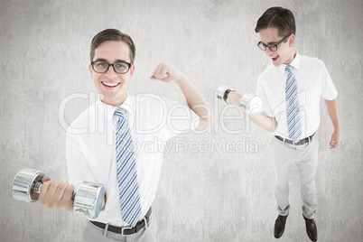 Composite image of nerd lifting dumbbell