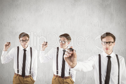 Composite image of nerdy businessman writing