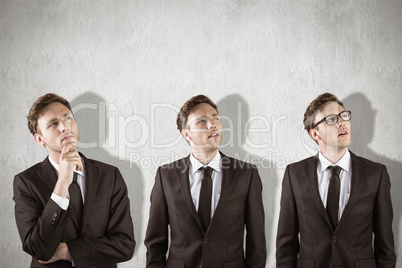 Composite image of nerdy businessman thinking