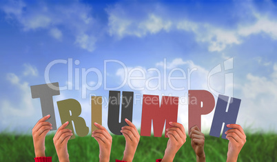 Composite image of hands holding up triumph