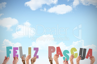 Composite image of hands holding up feliz pasqua