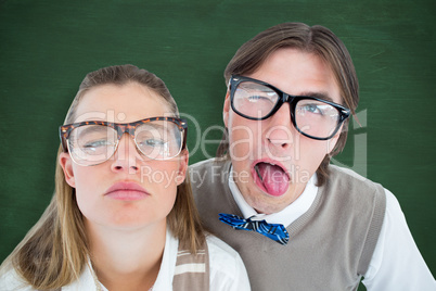 Composite image of funny geeky hipsters grimacing