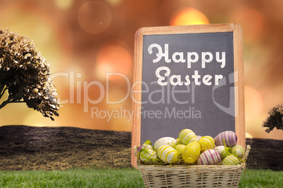 Composite image of easter eggs in basket