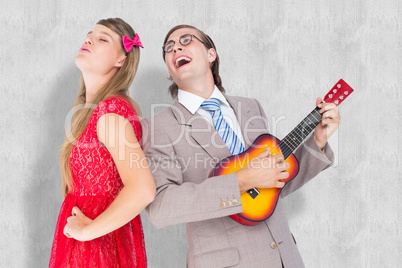 Composite image of hipster couple having fun together