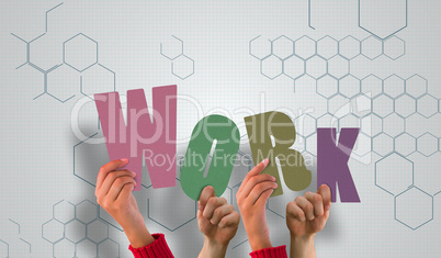 Composite image of hands holding up work