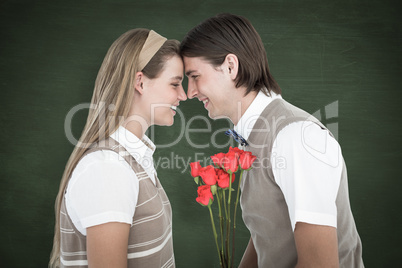 Composite image of happy geeky hipsters looking at each other