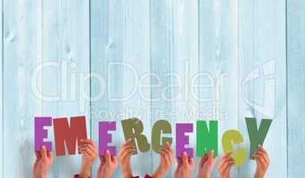 Composite image of hands holding up emergency