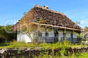 old farmhouse with a thatched roof