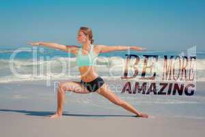 Composite image of fit woman standing on the beach in warrior po