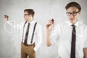 Composite image of nerdy businessman writing