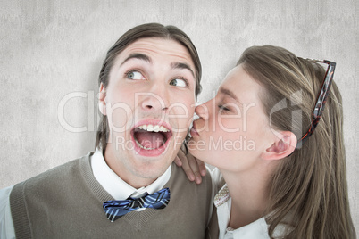 Composite image of pretty geeky hipster giving boyfriend kiss on