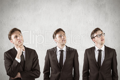 Composite image of nerdy businessman thinking